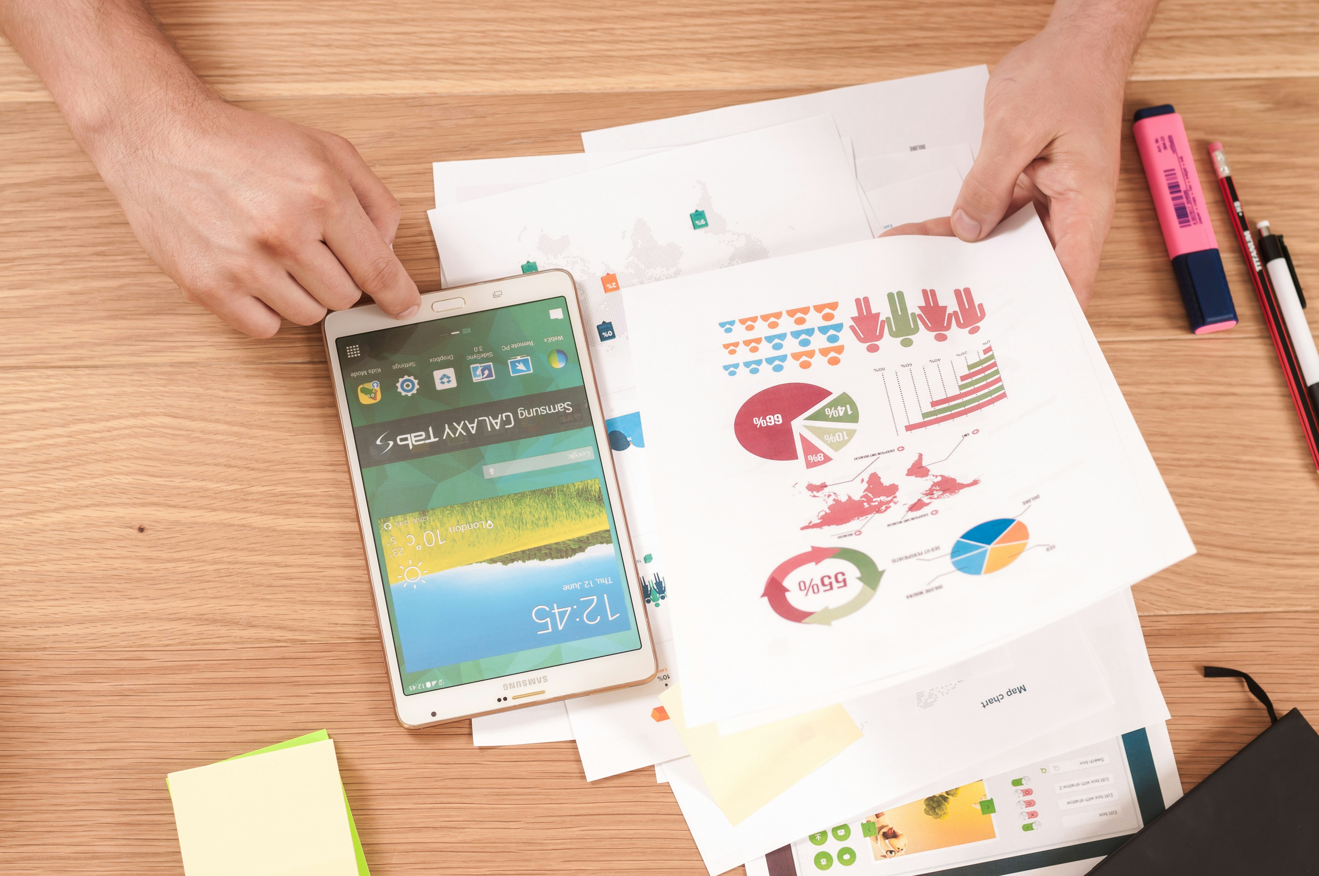 Printed analytics next to tablet